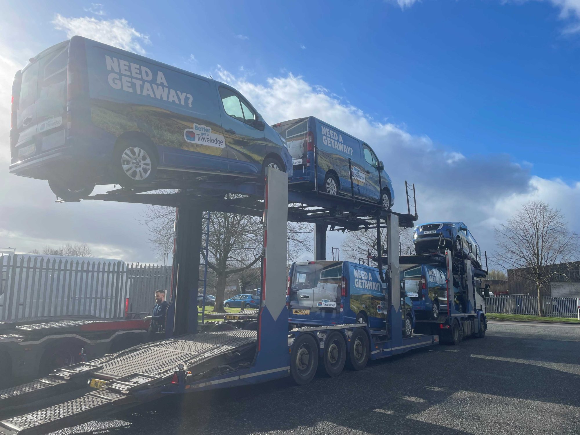 Travelodge vans on truck